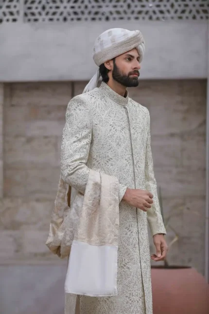 Pistachio sherwani with handmade embroidery and designer metal buttons