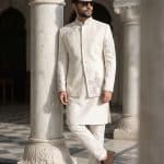 Elevate your festive look with this luxurious off-white Prince Coat crafted from premium tropical fabric.