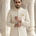 Step into timeless elegance with this luxurious ivory prince coat crafted from premium viscose silk fabric.