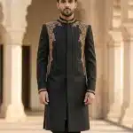 Experience royal sophistication with this luxurious black sherwani crafted from premium Tropical fabric. Designed for the modern gentleman,