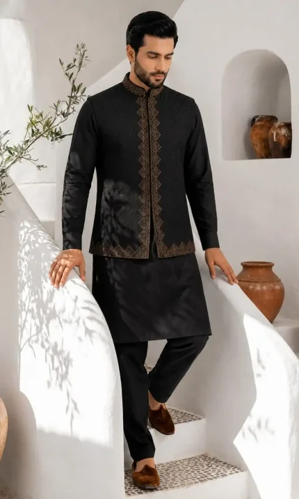 Elevate your traditional wardrobe with this luxurious black embroidered waistcoat set, designed for men who appreciate timeless eastern fashion with a modern touch.