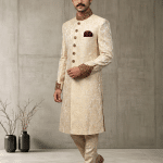 Elevate your wedding and festive look with this Luxury IvoryJamawar Sherwani, crafted from premium Jamawar fabric featuring an elegant woven pattern.