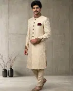 Elevate your wedding and festive look with this Luxury IvoryJamawar Sherwani, crafted from premium Jamawar fabric featuring an elegant woven pattern.