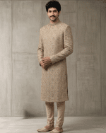 Elevate your wedding and festive wardrobe with this exquisite beige silk sherwani, meticulously crafted with intricate handcrafted zardozi embroidery.