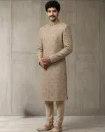 Elevate your wedding and festive wardrobe with this exquisite beige silk sherwani, meticulously crafted with intricate handcrafted zardozi embroidery.