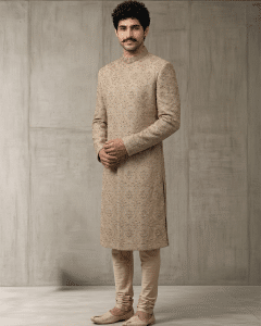 Home 4 Elevate your wedding and festive wardrobe with this exquisite beige silk sherwani, meticulously crafted with intricate handcrafted zardozi embroidery.
