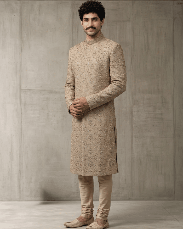 Elevate your wedding and festive wardrobe with this exquisite beige silk sherwani, meticulously crafted with intricate handcrafted zardozi embroidery.