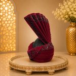 Complete your royal wedding look with this Luxury Maroon Velvet Groom Turban, expertly handcrafted from premium velvet fabric and adorned with elegant black bead embellishments.