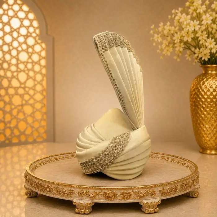 Elevate your wedding look with our Royal Ivory Groom Turban, designed for a sophisticated and majestic appearance. Crafted with premium fabric and detailed embroidery work
