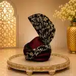 Elevate your wedding look with this premium black and maroon luxury turban, beautifully crafted with elegant golden embroidery.