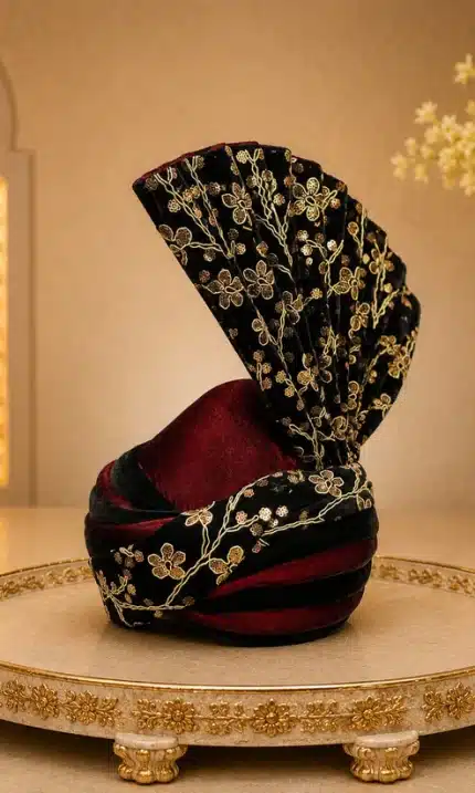 Elevate your wedding look with this premium black and maroon luxury turban, beautifully crafted with elegant golden embroidery.