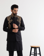 Elevate your formal and festive wardrobe with this premium black tropical fabric waistcoat, featuring exquisite handmade embroidery.