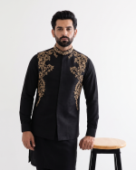 Black tropical fabric handmade embroidered men's waistcoat with elegant gold floral embroidery, mandarin collar, premium ethnic formal wear for weddings and festive occasions."