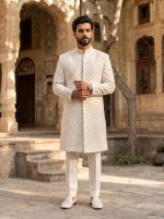 Off-white handmade embroidered groom sherwani with floral detailing and band collar.