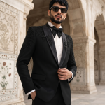 Black handmade embroidered designer tuxedo suit for men with luxury detailing and elegant formal wedding style.