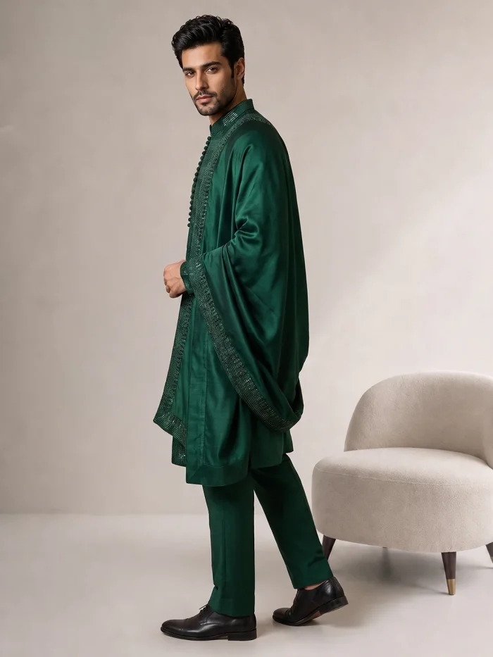 Luxury Emerald Green Embroidered Kurta Pajama – Royal Eastern Wear Male model wearing a luxury emerald green embroidered kurta pajama with a matching embellished shawl for weddings and festive occasions.