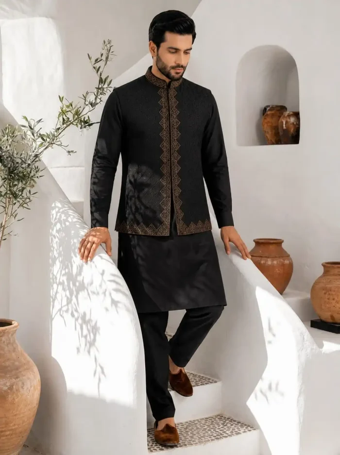 Elevate your traditional wardrobe with this luxurious black embroidered waistcoat set, designed for men who appreciate timeless eastern fashion with a modern touch.